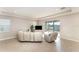 Bright and airy living room features sliding glass doors and access to the kitchen at 12436 Shining Willow St, Riverview, FL 33579