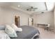 This main bedroom is bright and airy, with tray ceilings, a ceiling fan, and plush carpet at 12436 Shining Willow St, Riverview, FL 33579