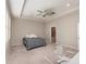 Comfortable main bedroom with carpet, a ceiling fan, recessed lighting, and access to the ensuite bathroom at 12436 Shining Willow St, Riverview, FL 33579