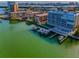 Aerial view of condo building with boat docks, providing direct waterfront access at 125 Island Way # 502, Clearwater Beach, FL 33767