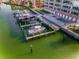 Aerial view of the boat docks, condo, and community pool at 125 Island Way # 502, Clearwater Beach, FL 33767