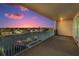 Expansive balcony offering panoramic views of the sunset over the waterfront and city lights at 125 Island Way # 502, Clearwater Beach, FL 33767