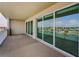 Covered balcony with ample space for seating and entertaining, featuring sliding glass doors to the interior at 125 Island Way # 502, Clearwater Beach, FL 33767