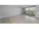 Modern bedroom with large sliding glass door leading to balcony with city views at 125 Island Way # 502, Clearwater Beach, FL 33767