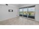 Bright and airy bedroom with tiled floors and large sliding glass doors leading to balcony at 125 Island Way # 502, Clearwater Beach, FL 33767