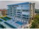 Upscale condo exterior with balconies, a pool, and waterfront access at 125 Island Way # 502, Clearwater Beach, FL 33767