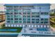 Beautiful waterfront condo building featuring multiple floors and a community pool at 125 Island Way # 502, Clearwater Beach, FL 33767