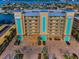 An attractive multi-story condo building with ample parking, waterfront access, and architectural details at 125 Island Way # 502, Clearwater Beach, FL 33767