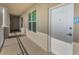 Hallway featuring neutral walls, exterior windows, and white apartment doors marked with unit number at 125 Island Way # 502, Clearwater Beach, FL 33767