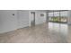 Open-concept living area with tile floors and access to a balcony overlooking beautiful city views at 125 Island Way # 502, Clearwater Beach, FL 33767