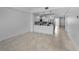Inviting living area with open floor plan, stylish tile floors, and well-lit kitchen at 125 Island Way # 502, Clearwater Beach, FL 33767