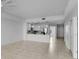 Bright living room featuring open layout, tile flooring, and seamless transition to the modern kitchen at 125 Island Way # 502, Clearwater Beach, FL 33767