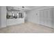 Open-concept living space with tile flooring, integrated kitchen with a breakfast bar, and lots of natural light at 125 Island Way # 502, Clearwater Beach, FL 33767