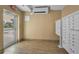 Beige lobby featuring tiled floors, mailboxes, mini split air conditioner, and glass door to exit to parking lot at 125 Island Way # 502, Clearwater Beach, FL 33767