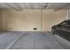This parking garage features marked spots and a parked car at 125 Island Way # 502, Clearwater Beach, FL 33767