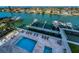Aerial view of pool with lounge chairs and boat docks on the waterfront at 125 Island Way # 502, Clearwater Beach, FL 33767