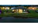 Aerial view of the backyard pool, screened-in lanai and waterfront, great for entertaining at 12710 Wheatgrass Ct, Parrish, FL 34219