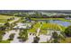 Aerial of community amenities with pool, lake, and recreational facilities at 12710 Wheatgrass Ct, Parrish, FL 34219