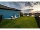 Manicured backyard overlooking a serene pond, complete with pump and filtering system at 12710 Wheatgrass Ct, Parrish, FL 34219