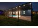 View of the back of the house with a screened in lanai, lights, pool and jacuzzi at 12710 Wheatgrass Ct, Parrish, FL 34219