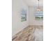 Bright bedroom with tile floors, baseboards, and two windows at 12710 Wheatgrass Ct, Parrish, FL 34219