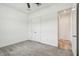 Carpeted bedroom featuring a modern ceiling fan and double door closet at 12710 Wheatgrass Ct, Parrish, FL 34219