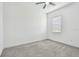 Carpeted bedroom featuring a modern ceiling fan and a window with blinds at 12710 Wheatgrass Ct, Parrish, FL 34219