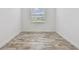Bright bedroom features tile floors and a large window for natural light at 12710 Wheatgrass Ct, Parrish, FL 34219