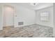 Unfurnished room with light-colored wood-look floors and white walls at 12710 Wheatgrass Ct, Parrish, FL 34219