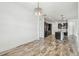 Bright kitchen with stainless steel appliances, granite island, and decorative lighting at 12710 Wheatgrass Ct, Parrish, FL 34219