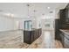 Kitchen island with granite countertops and stainless steel faucet at 12710 Wheatgrass Ct, Parrish, FL 34219