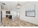 Bright living room with tile floors and kitchen view at 12710 Wheatgrass Ct, Parrish, FL 34219