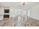 Bright living room with tile floors, arches, and access to multiple rooms at 12710 Wheatgrass Ct, Parrish, FL 34219