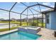 The perfect screened in pool and spa combo overlooking a picturesque backyard and serene lake at 12710 Wheatgrass Ct, Parrish, FL 34219