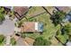 Aerial view of the backyard featuring a pool and a well-maintained lawn with privacy fence at 1313 Key West Ct, Wesley Chapel, FL 33544
