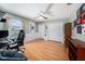 Spacious bedroom featuring light-colored walls, hardwood floors, a ceiling fan, and two closets at 1313 Key West Ct, Wesley Chapel, FL 33544