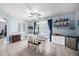 Inviting dining area with elegant dining table, stylish decor, and a mini bar for entertaining at 1313 Key West Ct, Wesley Chapel, FL 33544