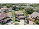 Charming two-story home with a well-manicured front yard, mature trees, and a two-car garage at 1313 Key West Ct, Wesley Chapel, FL 33544