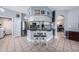 Modern kitchen with stainless steel appliances, bar seating, and an open layout great for entertaining guests at 1313 Key West Ct, Wesley Chapel, FL 33544