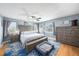 Comfortable main bedroom suite with a large bed, hardwood floors, and matching wood furniture set at 1313 Key West Ct, Wesley Chapel, FL 33544