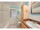Charming bathroom with blue accents and a classic vanity cabinet at 16201 Country Crossing Dr, Tampa, FL 33624