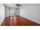 Bedroom with hardwood floors and French doors that lead to the pool at 16201 Country Crossing Dr, Tampa, FL 33624