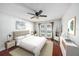 Staged primary bedroom with hardwood floors and access to the pool at 16201 Country Crossing Dr, Tampa, FL 33624