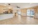 Open concept dining area with tile floors, eat-in kitchen and sliding door access to the lanai at 16201 Country Crossing Dr, Tampa, FL 33624