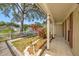 Inviting front porch with decorative columns and shutters, enhancing the home's curb appeal at 16201 Country Crossing Dr, Tampa, FL 33624