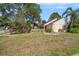 Charming single-story home featuring a well-manicured front yard and beautiful landscaping at 16201 Country Crossing Dr, Tampa, FL 33624