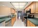 Modern kitchen featuring stainless steel appliances, tile floors and generous countertops at 16201 Country Crossing Dr, Tampa, FL 33624