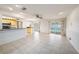 Open-concept kitchen with tile floors, breakfast bar, and backyard pool access at 16201 Country Crossing Dr, Tampa, FL 33624