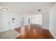 Inviting living room featuring hardwood floors, neutral walls, and lots of natural light at 16201 Country Crossing Dr, Tampa, FL 33624