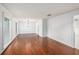 Spacious living room with hardwood floors, neutral walls, and simple lighting at 16201 Country Crossing Dr, Tampa, FL 33624